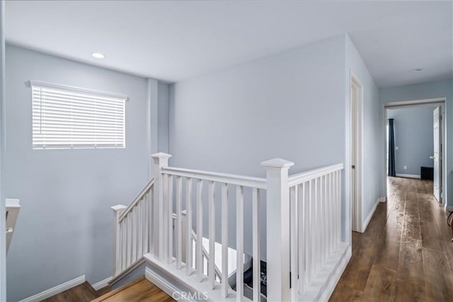 interior space featuring recessed lighting, baseboards, and wood finished floors