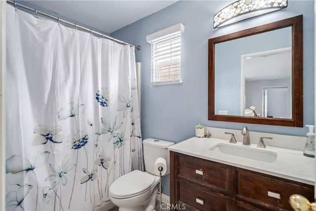 full bath with a shower with curtain, toilet, and vanity