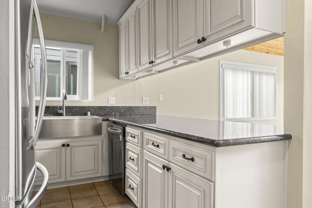 276 Highland Dr, Oxnard, CA 93035 - kitchen featuring appliances with stainless steel finishes, a sink, white cabinets, tile patterned flooring, and a peninsula