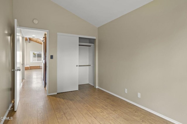 276 Highland Dr, Oxnard, CA 93035 - unfurnished bedroom featuring vaulted ceiling, light wood finished floors, baseboards, and a closet