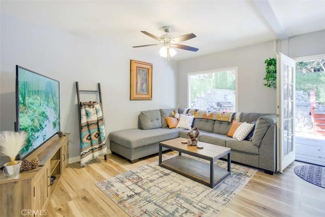 874 Fern Dr, Crestline, CA 92325 - living area featuring light wood finished floors, a ceiling fan, and beamed ceiling