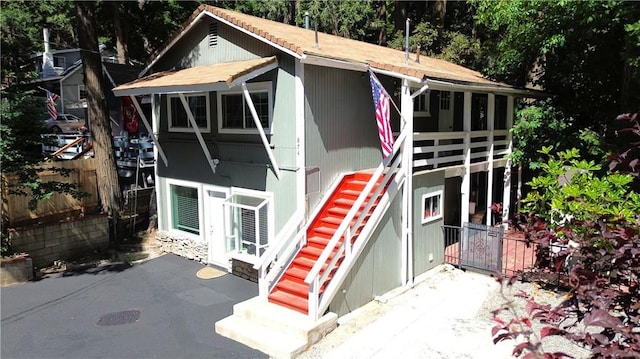 874 Fern Dr, Crestline, CA 92325 - view of front of home with stairs and a patio