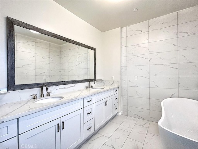 139 E Puente St, Covina, CA 91723 - full bath with marble look tiles, a freestanding tub, and double vanity