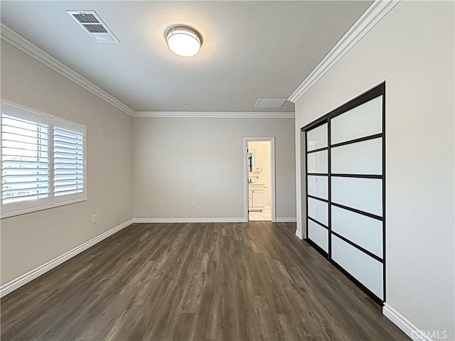 139 E Puente St, Covina, CA 91723 - unfurnished room with dark wood-style flooring, crown molding, and baseboards