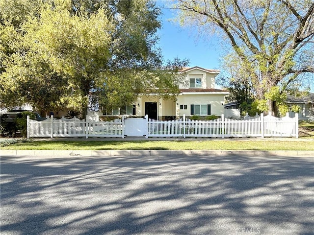 139 E Puente St, Covina, CA 91723 - view of front of property with stucco siding and a fenced front yard