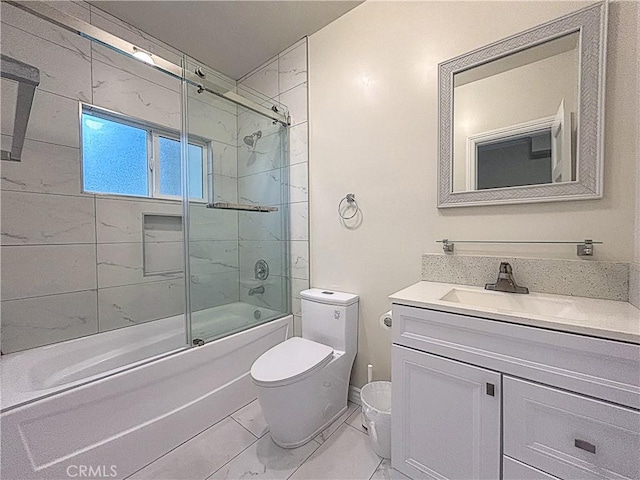 139 E Puente St, Covina, CA 91723 - bathroom featuring toilet, vanity, enclosed tub / shower combo, and marble look tiles
