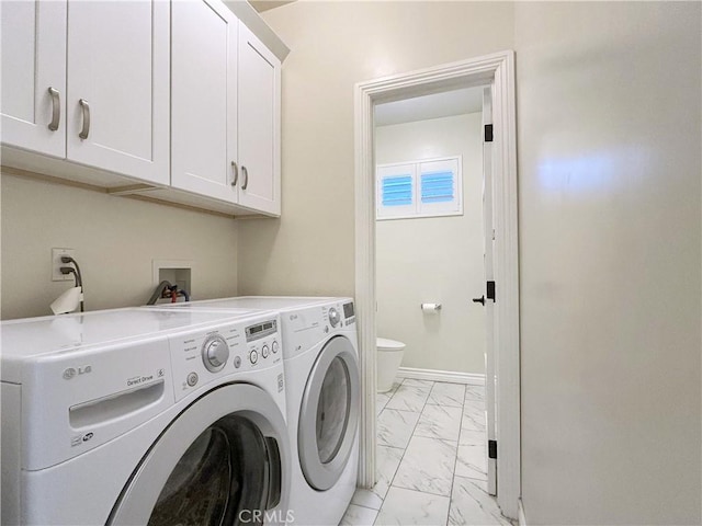 139 E Puente St, Covina, CA 91723 - clothes washing area featuring light marble finish flooring, cabinet space, washing machine and clothes dryer, and baseboards