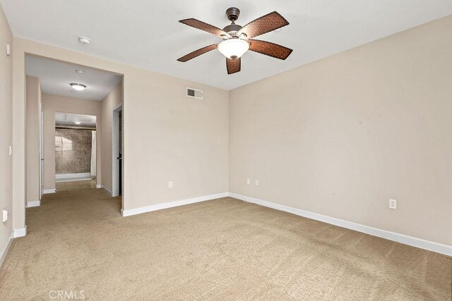 1021 Costa Pacifica Way Unit 2105, Oceanside, CA 92054 - spare room featuring light colored carpet, a ceiling fan, and a smoke detector