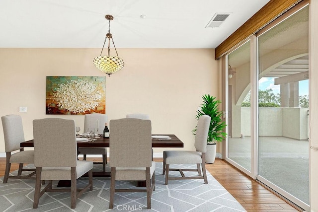 1021 Costa Pacifica Way Unit 2105, Oceanside, CA 92054 - dining space with wood finished floors