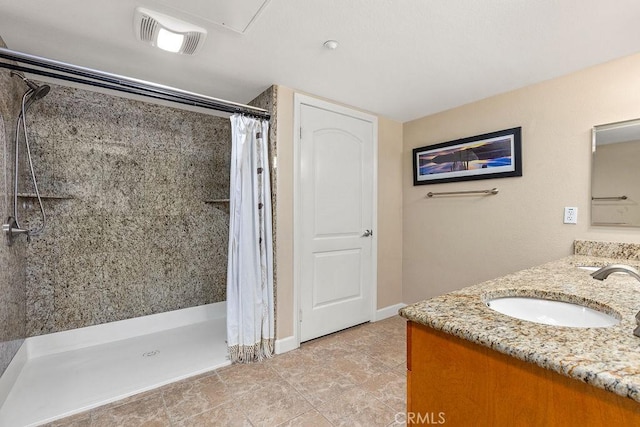 1021 Costa Pacifica Way Unit 2105, Oceanside, CA 92054 - bathroom featuring double vanity and a tile shower