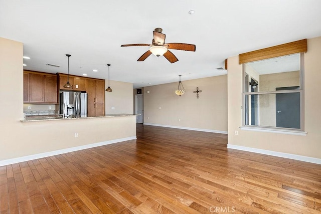 1021 Costa Pacifica Way Unit 2105, Oceanside, CA 92054 - unfurnished living room with ceiling fan, light wood finished floors, and recessed lighting