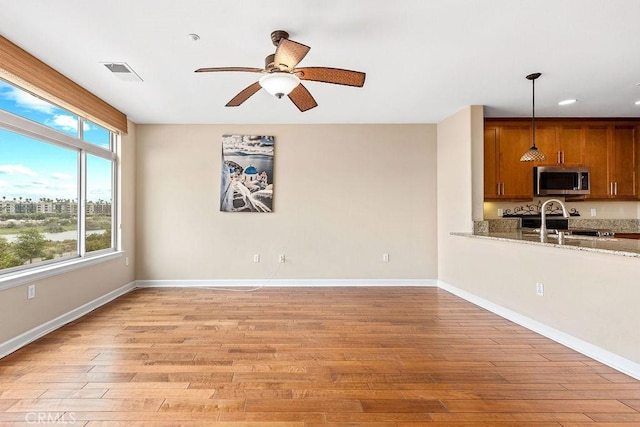 1021 Costa Pacifica Way Unit 2105, Oceanside, CA 92054 - unfurnished living room featuring light wood finished floors, ceiling fan, and recessed lighting