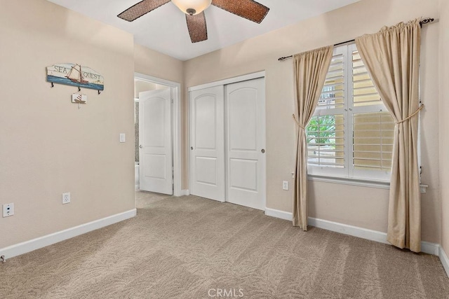 1021 Costa Pacifica Way Unit 2105, Oceanside, CA 92054 - unfurnished bedroom featuring carpet flooring, a closet, and a ceiling fan