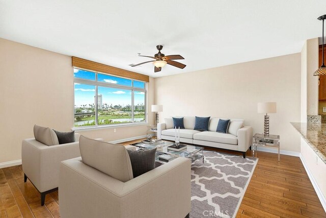 1021 Costa Pacifica Way Unit 2105, Oceanside, CA 92054 - living area featuring wood-type flooring and ceiling fan