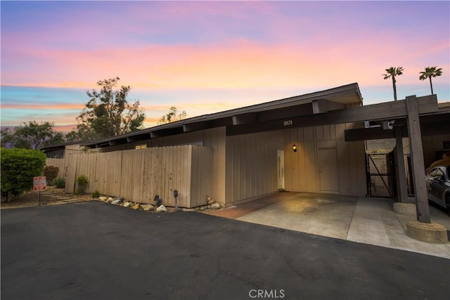 view of front of house featuring fence