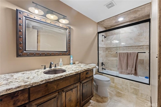 1985 Golden Rod Ave, Big Bear City, CA 92314 - full bathroom with visible vents, toilet, tiled shower / bath combo, and vanity