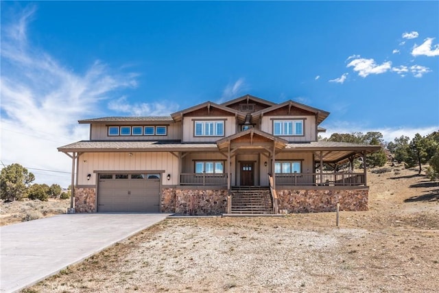 1985 Golden Rod Ave, Big Bear City, CA 92314 - view of front facade with covered porch, a garage, board and batten siding, and concrete driveway