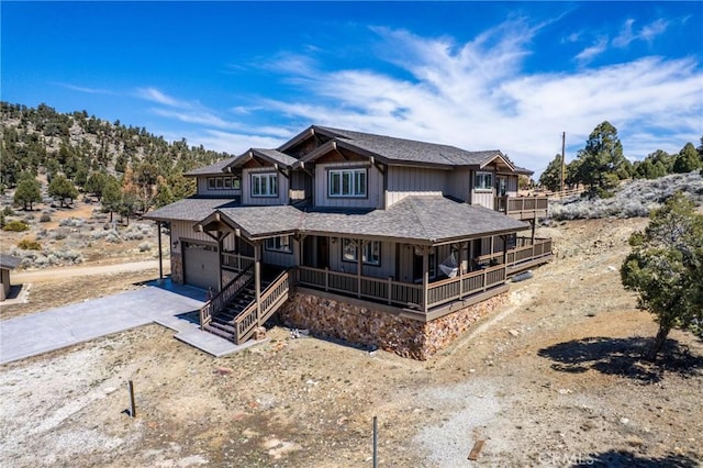 1985 Golden Rod Ave, Big Bear City, CA 92314 - view of front of house featuring a porch, a garage, and concrete driveway