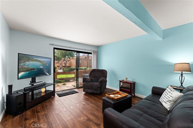 living area featuring beam ceiling, wood finished floors, and baseboards