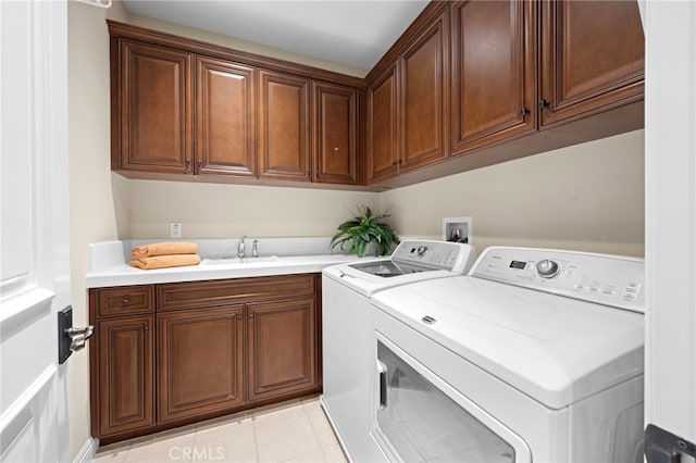 28 Surfspray Blf, Newport Coast, CA 92657 - laundry room with cabinet space, washer and dryer, and light tile patterned floors