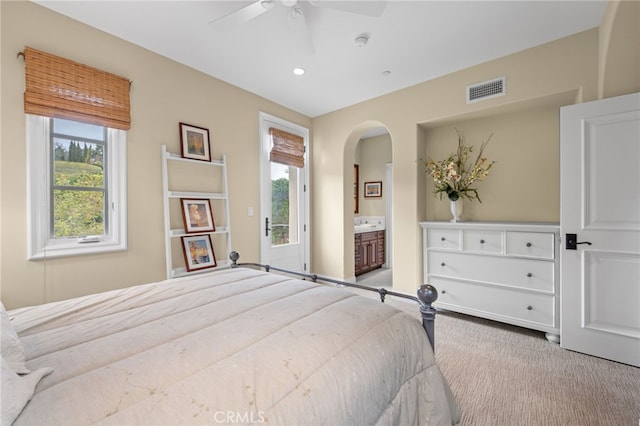 28 Surfspray Blf, Newport Coast, CA 92657 - bedroom featuring multiple windows, carpet floors, arched walkways, recessed lighting, and ensuite bath