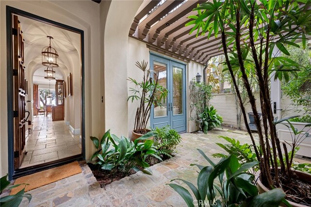 28 Surfspray Blf, Newport Coast, CA 92657 - entrance to property with french doors, stucco siding, and a pergola