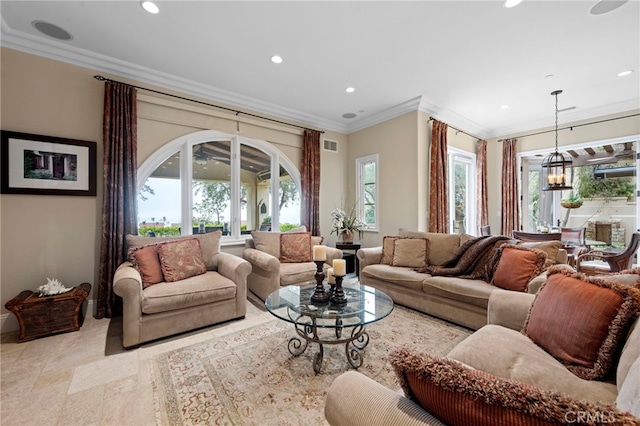 living area with baseboards, ornamental molding, visible vents, and recessed lighting