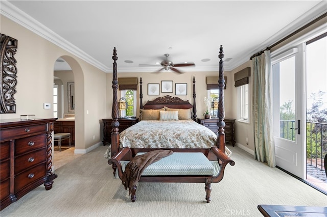 28 Surfspray Blf, Newport Coast, CA 92657 - bedroom featuring light carpet, access to exterior, arched walkways, ornamental molding, and ensuite bathroom