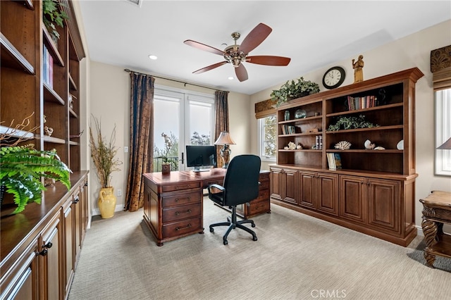 home office featuring light colored carpet, ceiling fan, baseboards, and recessed lighting