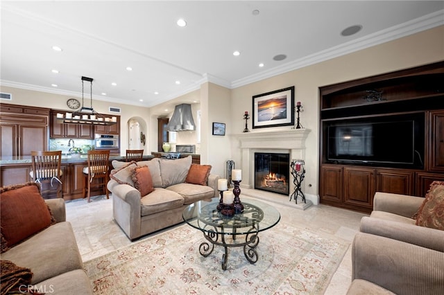 28 Surfspray Blf, Newport Coast, CA 92657 - living area with recessed lighting, a glass covered fireplace, and crown molding