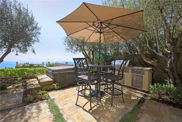 28 Surfspray Blf, Newport Coast, CA 92657 - view of patio featuring a hot tub, area for grilling, and outdoor dining space