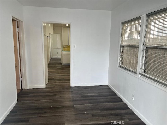 2223 W Olympic Blvd, Montebello, CA 90640 - interior space with baseboards and dark wood-style flooring