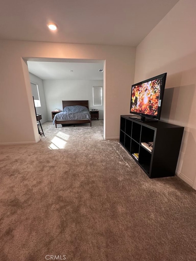 bedroom featuring carpet floors and baseboards