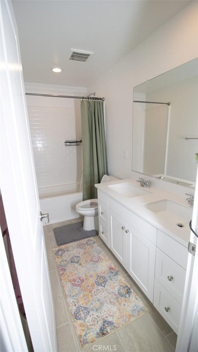 full bath with a sink, double vanity, toilet, shower / tub combo, and visible vents