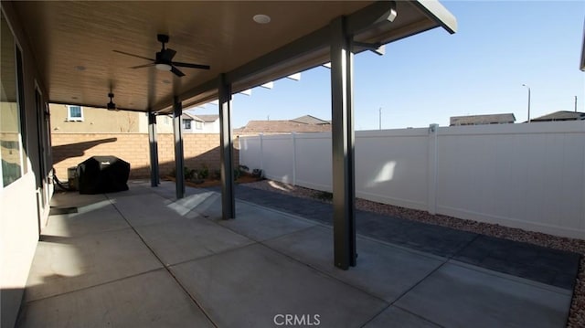 view of patio / terrace with a fenced backyard and ceiling fan