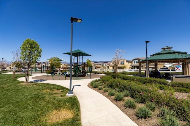 surrounding community featuring a lawn, a gazebo, and playground community