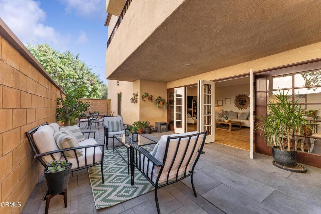 121 S Wilson Ave Unit 102, Pasadena, CA 91106 - view of patio featuring an outdoor living space and fence