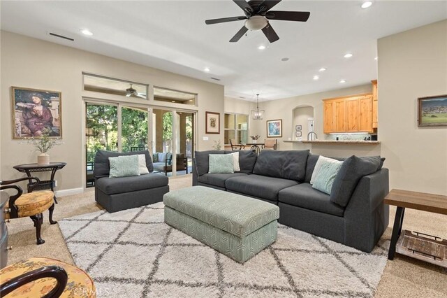 living area with visible vents, ceiling fan, recessed lighting, and light carpet