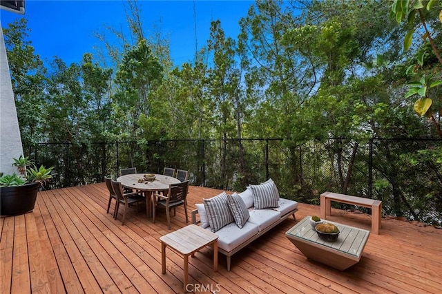 deck with an outdoor living space and outdoor dining space