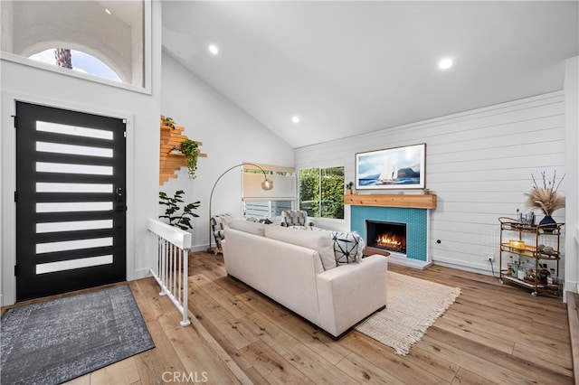 32772 Shipside Dr, Dana Point, CA 92629 - living room featuring high vaulted ceiling, a lit fireplace, light wood-type flooring, and recessed lighting