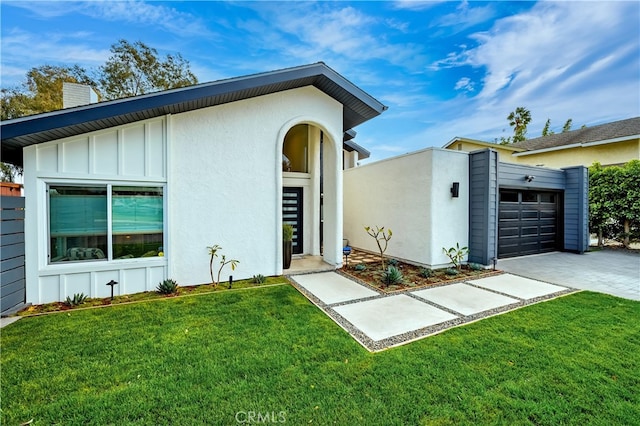 32772 Shipside Dr, Dana Point, CA 92629 - view of front of property with a chimney, board and batten siding, an attached garage, driveway, and a front yard