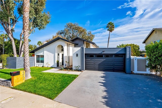 32772 Shipside Dr, Dana Point, CA 92629 - view of front of property featuring a garage, decorative driveway, stucco siding, and a gate