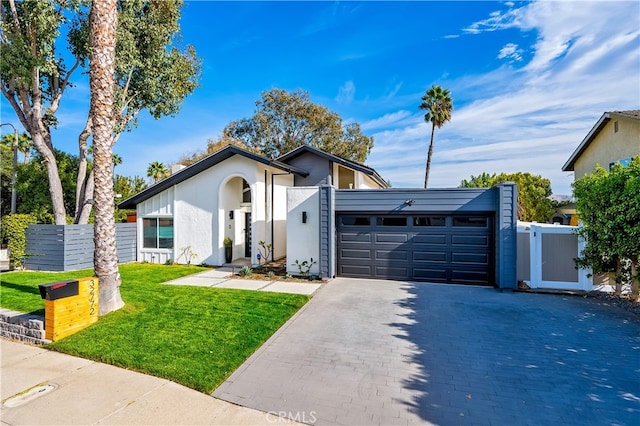 32772 Shipside Dr, Dana Point, CA 92629 - view of front facade with an attached garage, decorative driveway, stucco siding, and a gate