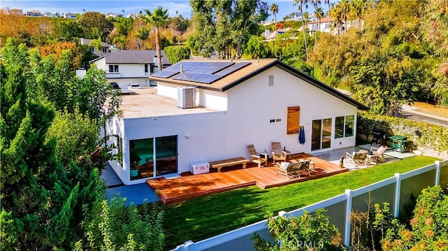 32772 Shipside Dr, Dana Point, CA 92629 - back of property with a wooden deck, stucco siding, and roof mounted solar panels