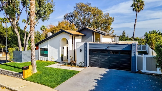 32772 Shipside Dr, Dana Point, CA 92629 - mid-century inspired home with asphalt driveway, stucco siding, a gate, and an attached garage