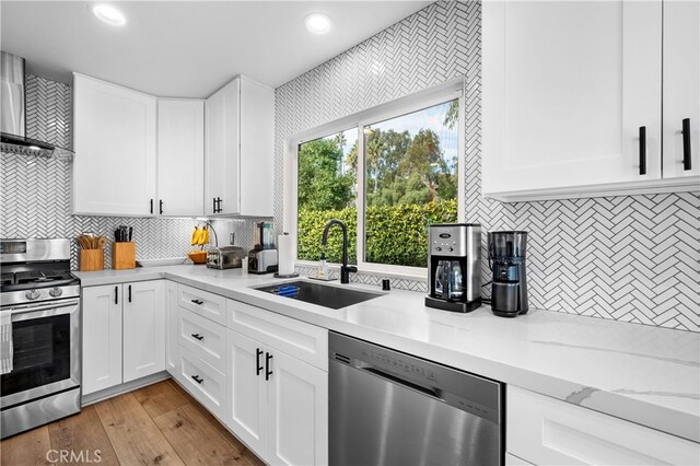 32772 Shipside Dr, Dana Point, CA 92629 - kitchen with appliances with stainless steel finishes, a sink, tasteful backsplash, white cabinets, and recessed lighting