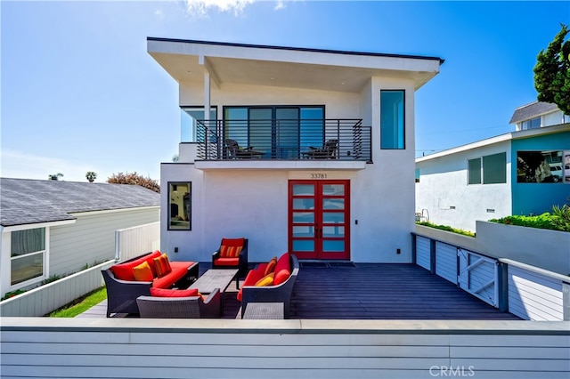 33781 Copper Lantern St, Dana Point, CA 92629 - back of house featuring stucco siding, a wooden deck, an outdoor living space, and a balcony