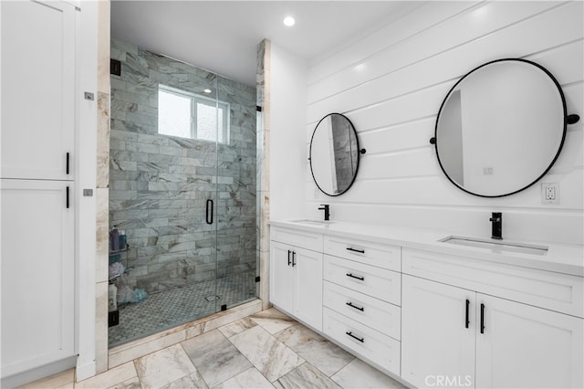 33781 Copper Lantern St, Dana Point, CA 92629 - full bathroom with double vanity, marble finish floor, a shower stall, and a sink