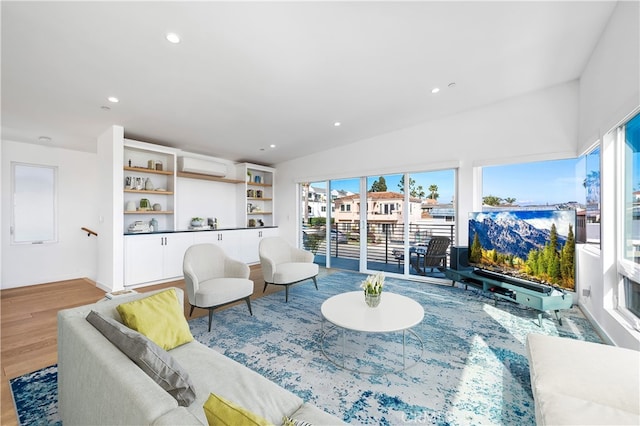 33781 Copper Lantern St, Dana Point, CA 92629 - living room with recessed lighting, a wall mounted air conditioner, and wood finished floors