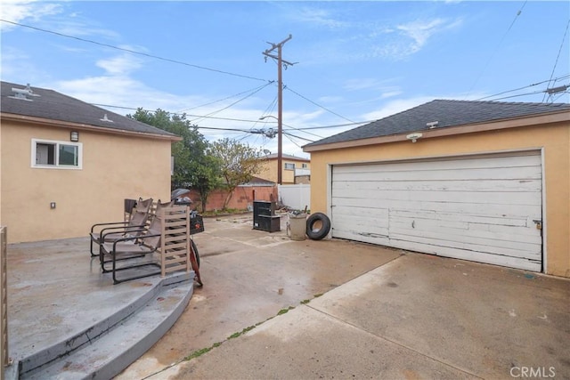 detached garage with fence
